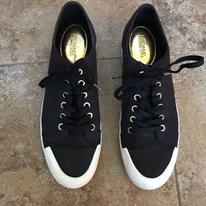 Black Michael Kors sneakers with gold detailing